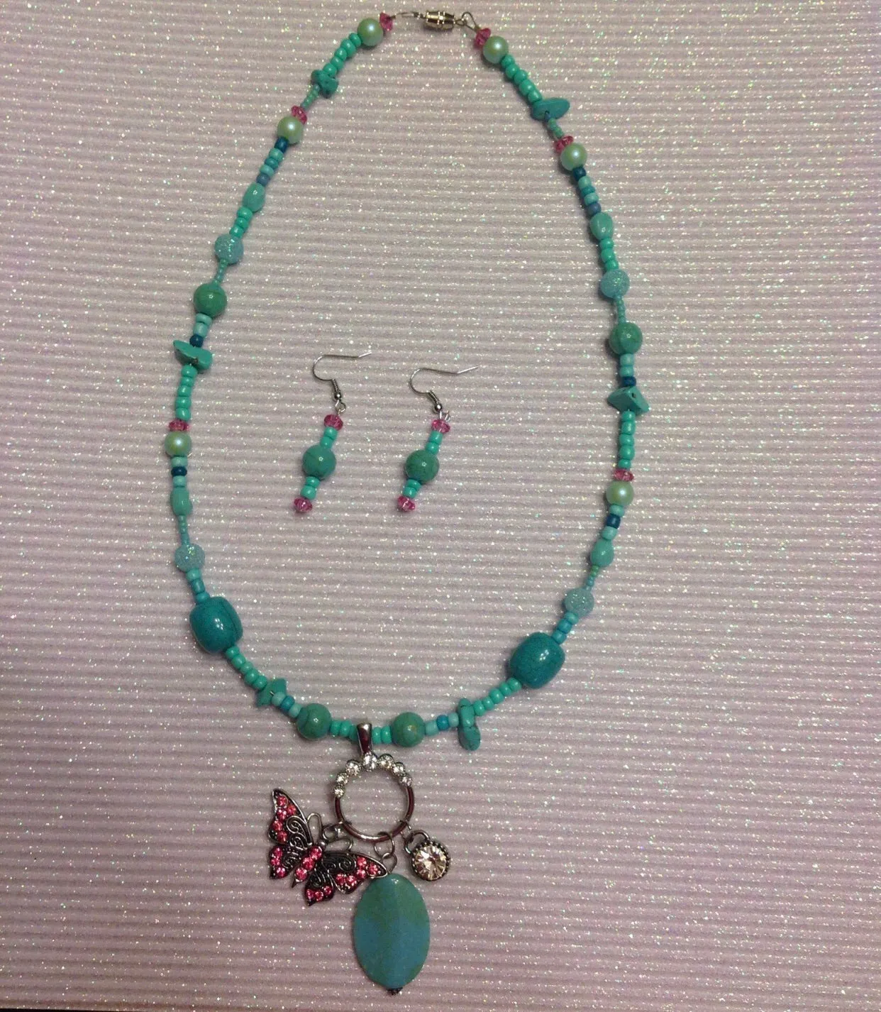 Butterfly necklace in blue and pink with earrings