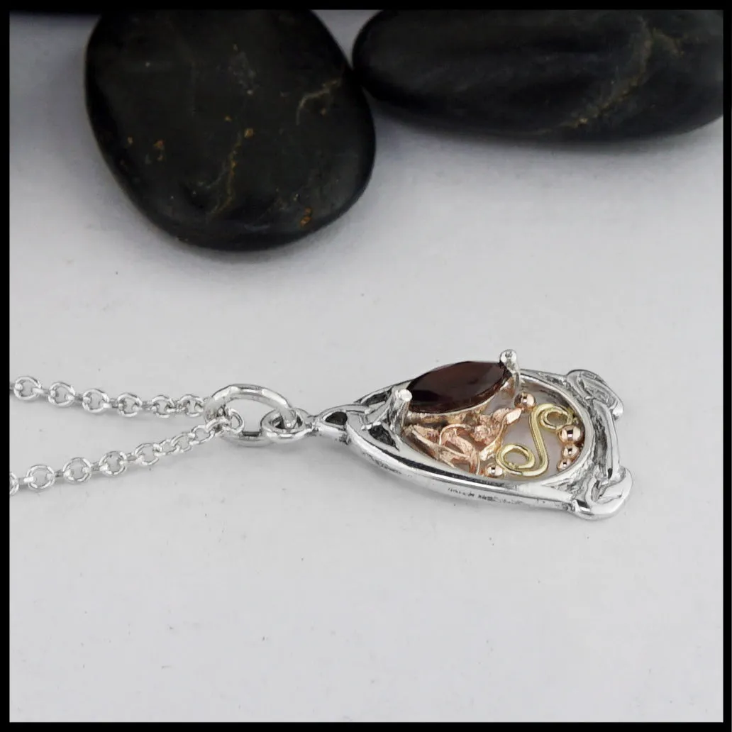 Trinity Knot Pendant with Garnet